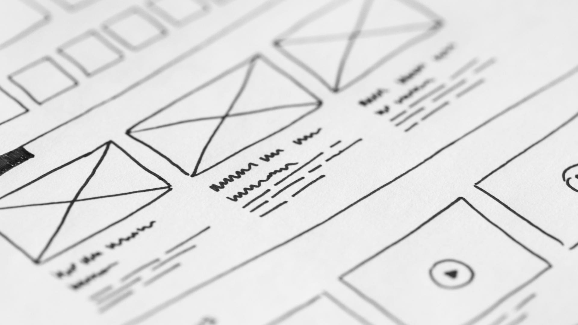Hand drawn website wireframe, low-fidelity sketches in black pen.