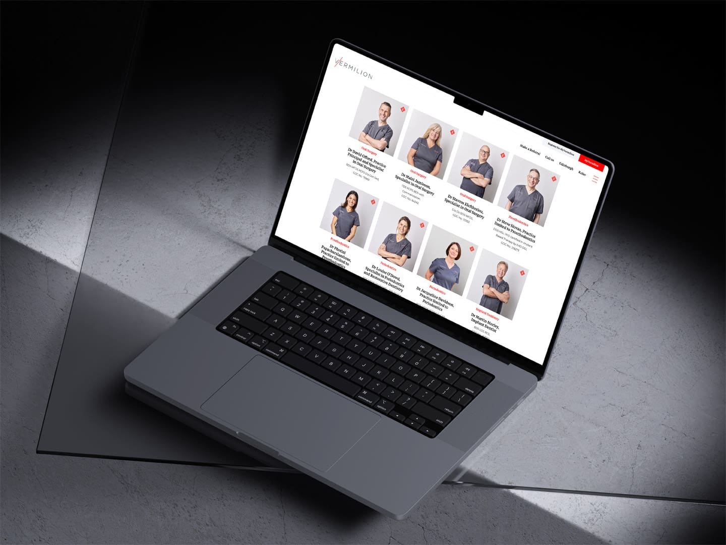 MacBook Pro laptop illustrating the Vermilion website Team page