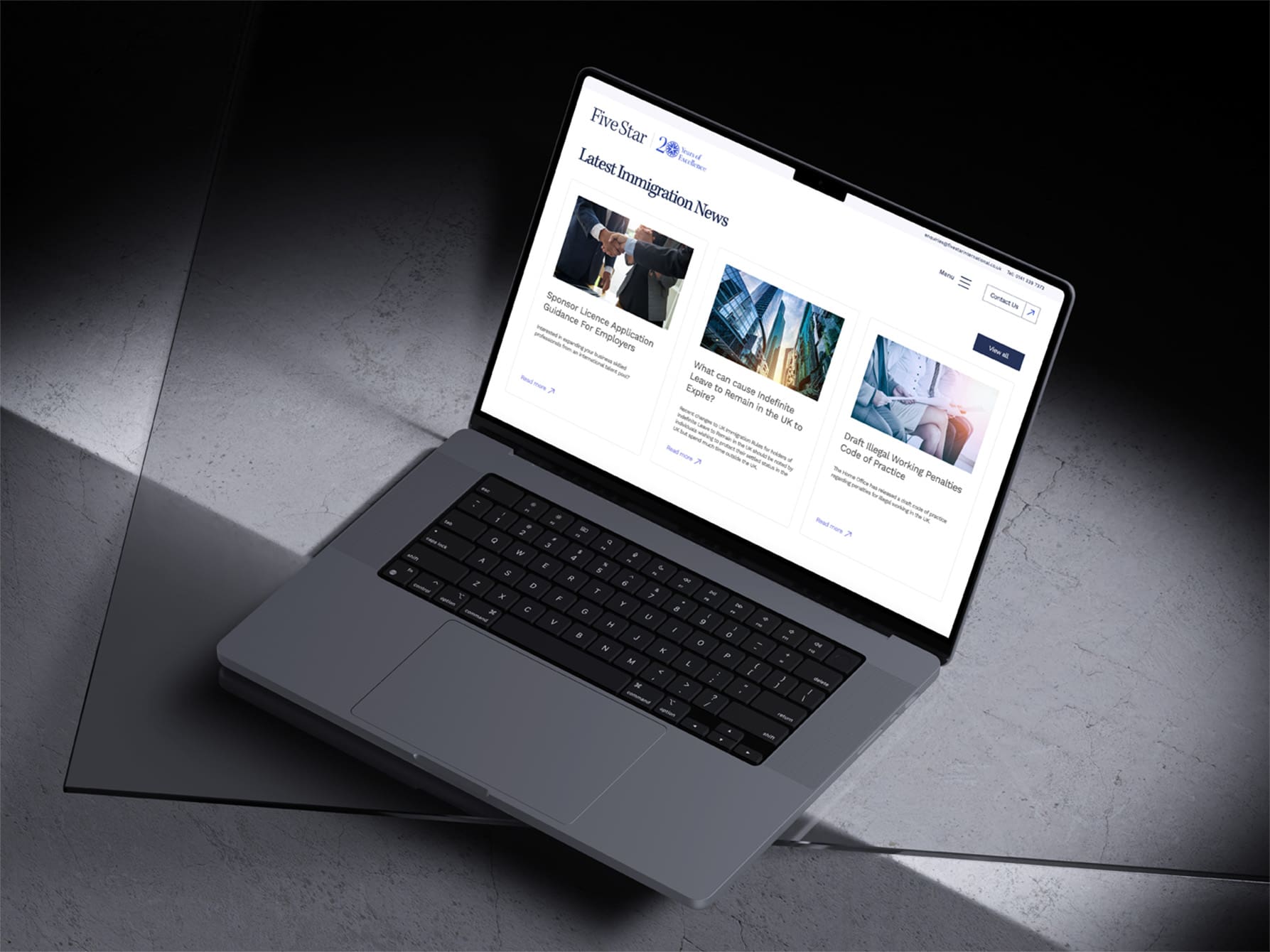 MacBook Pro laptop illustrating the Five Star International website news section