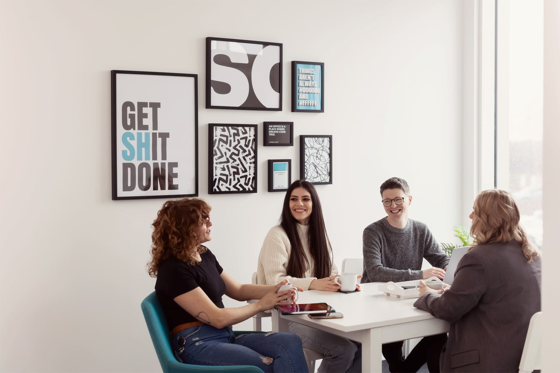 Group of People Gathered Around A Table For A Meeting